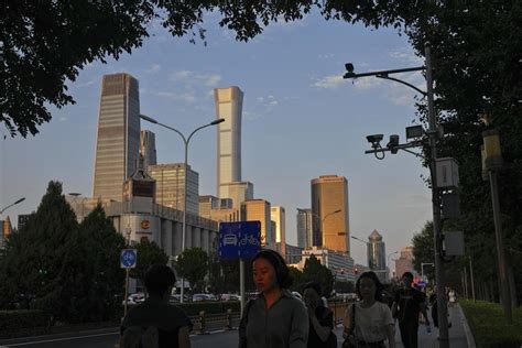 Chinese officials voice faith in economy and keep interest rates steady as forecasts darken